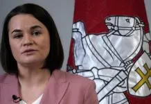Білоруська опозиціонерка Світлана Тихановська прибуде до України Світлана Тихановська на тлі прапора Білорусі