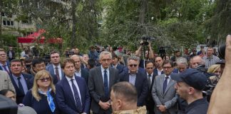 Ambassadors near the destroyed building in Kyiv