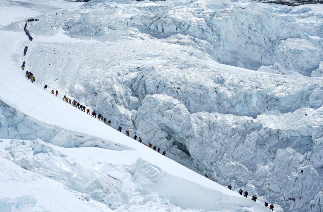 Climbers on the top of Mount Everest during a record-breaking ascent