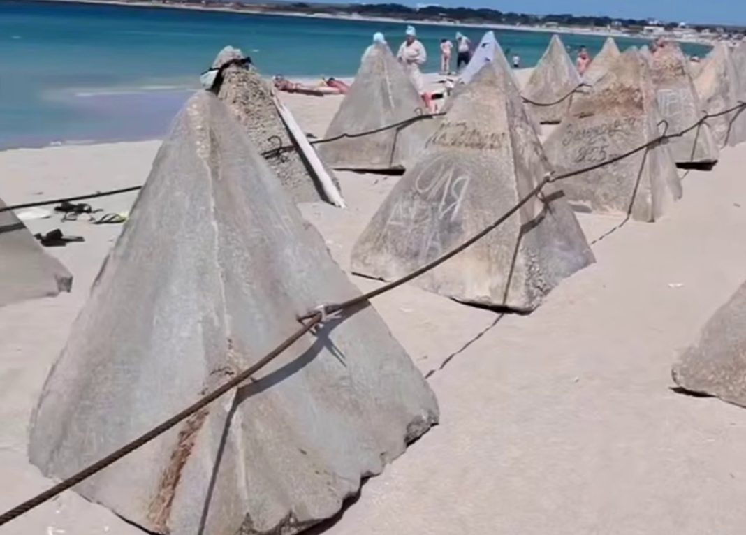 Concrete «dragon's teeth» and fortifications on the beach in occupied Crimea