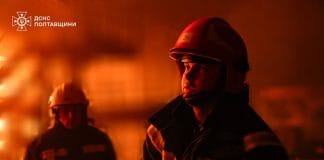 Rescuers at the scene of the attack in Poltava region