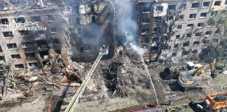Almost 300 buildings damaged in Kyiv after Russian attack Rescuers work at the site of destruction after a rocket attack in Kyiv