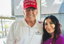 Американська блогерка Лора Лумер поруч із Дональдом Трампом під час спільної зустрічі.