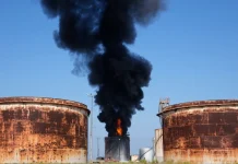 A fire at an oil tank following an attack on a fuel infrastructure facility in Russia.