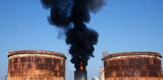 A fire at an oil tank following an attack on a fuel infrastructure facility in Russia.