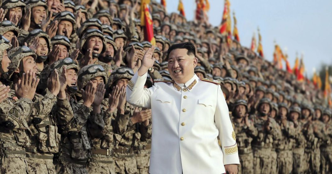 73f5b1c5156798d0b1e00bea40ce7a79 North Korean leader Kim Jong Un greets soldiers during a mass military event