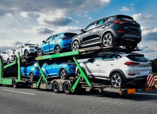 A truck transports a consignment of imported cars to Ukraine amid tightening customs controls