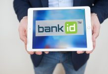 Зміни у системі BankID: платна участь для комерційних абонентів Логотип BankID Національного банку України на фоні комп'ютерного екрану.