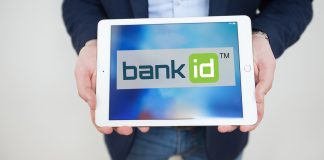 Логотип BankID Національного банку України на фоні комп'ютерного екрану.