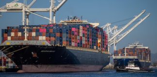 The US plans to impose additional duties on imports from 60 countries The port's cargo terminal with containers, symbolising international trade and customs restrictions.