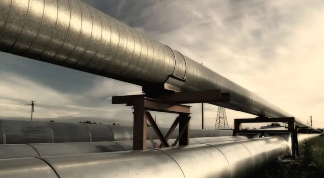 A landscape with gas pipeline pipes under construction in Algeria.