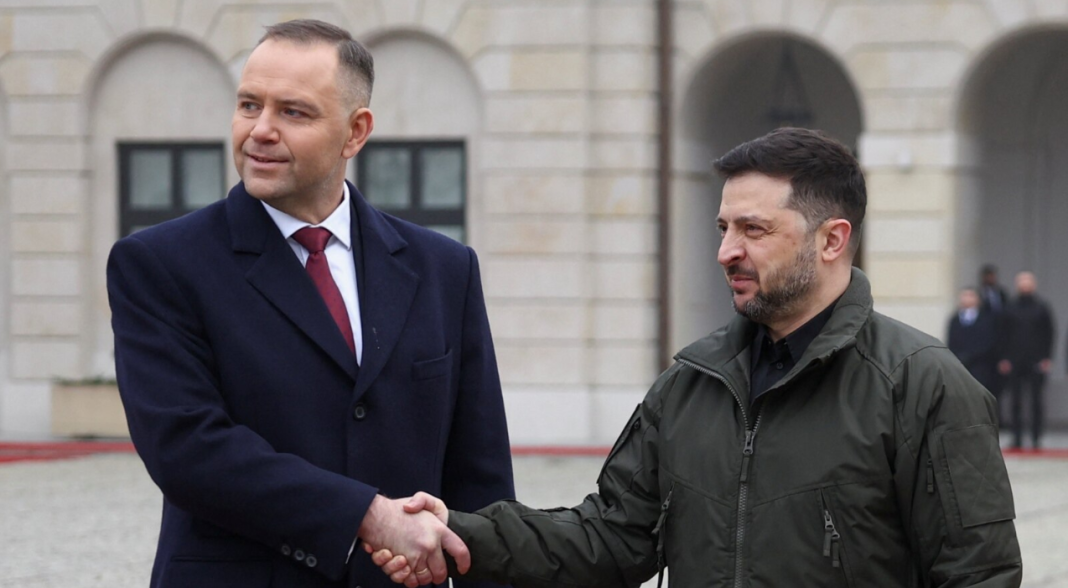 The President of Ukraine, Volodymyr Zelenskyy, shakes hands with the President of Poland, Karol Nawrocki, during an official meeting.