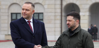 The President of Ukraine, Volodymyr Zelenskyy, shakes hands with the President of Poland, Karol Nawrocki, during an official meeting.
