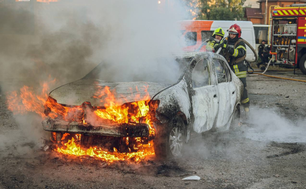 Russian UAV attack in Sumy: a burnt-out car in a car park.