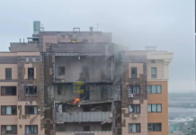 Fire and smoke above a high-rise block in Moscow after a drone struck it