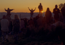 A still from the documentary *Glastonbury the Movie*, showing the audience at dawn on the first day of the 1993 Glastonbury Festival