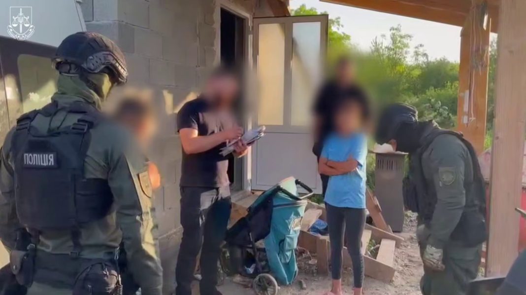 Law enforcement officers seize evidence during a search in the case of broadcasting pornography with a minor in Zakarpattia.