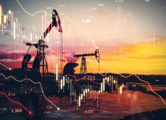 Нафтове піке: світові ціни повернулися до довоєнного рівня Нафтові вишки на тлі графіків падіння цін на нафту, що символізують зниження котирувань на світовому енергетичному ринку.