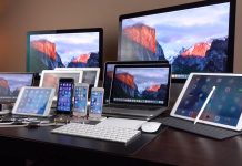 Tim Cook has announced that price rises for the iPhone and Mac are inevitable Apple’s range of devices, including the iPhone, iPad, MacBook, iMac and other Apple products, all displayed on a single desk.