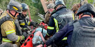 Rescuers evacuate victims after attack on Dnipro