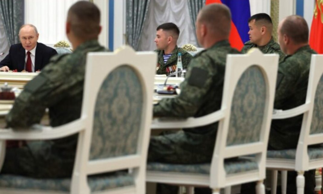 Russian President Vladimir Putin during a meeting with military personnel at the Kremlin on Russia Day