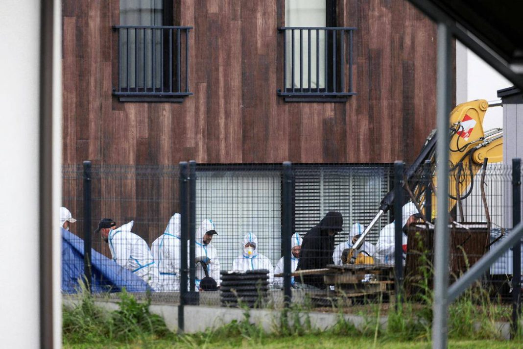 Excavations at the site in Lutoryzh where foetal remains were found, and investigators at the scene.
