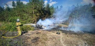 Rescue workers at the scene of a fire in the Kyiv region following an enemy attack.