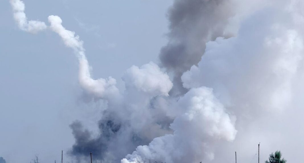 A column of thick smoke following the explosion and the activation of the air defence system