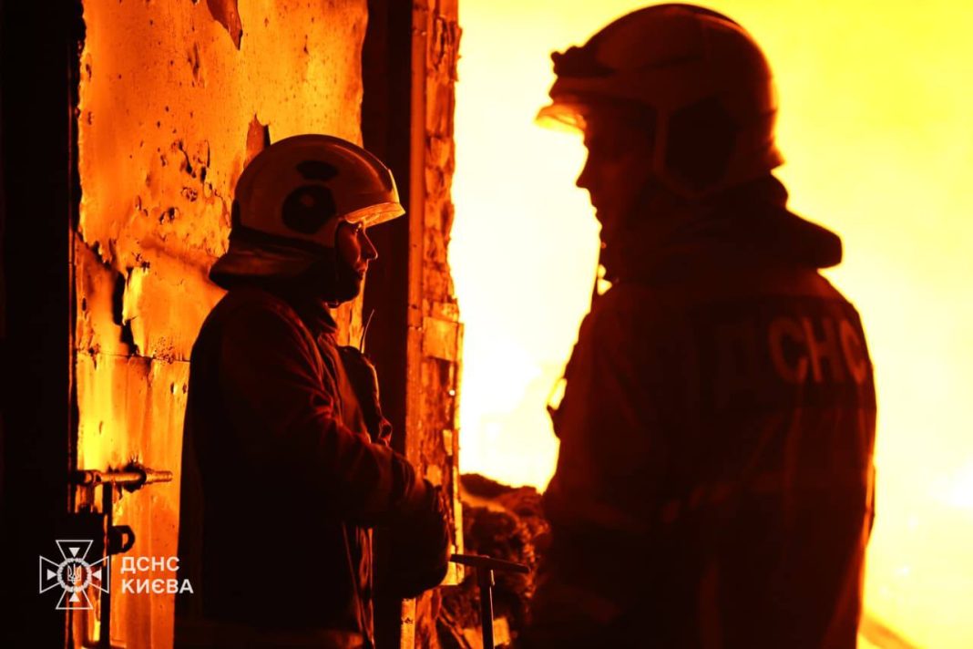Emergency services are putting out a fire in Kyiv following a shelling attack.