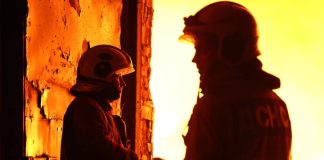 Emergency services are putting out a fire in Kyiv following a shelling attack.
