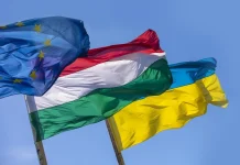 Hungary has once again blocked the progress of EU clusters for Ukraine The flags of Ukraine, Hungary and the European Union