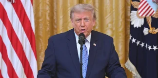 Trump has threatened the EU with tariffs over fines imposed on US tech companies Donald Trump and US flags