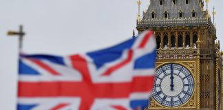 The flag of Great Britain against the backdrop of Big Ben in London