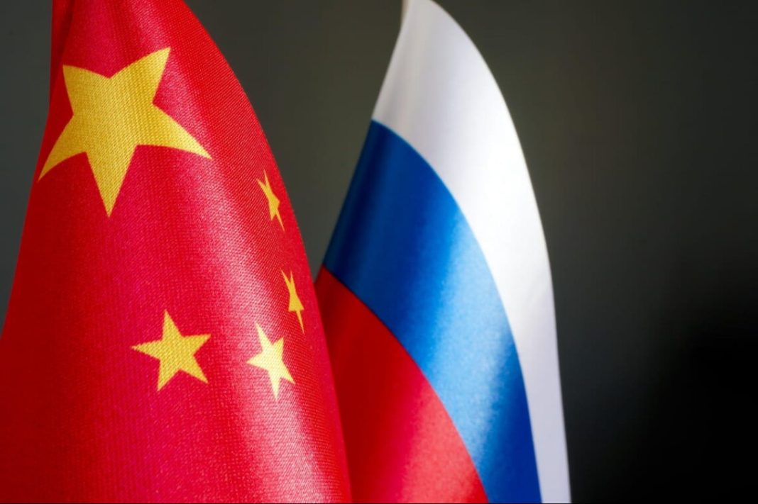 The flags of China and Russia as a symbol of military-technical cooperation.