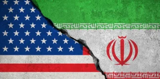 The flags of the US and Iran against the backdrop of the escalating conflict between the two countries