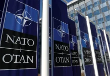 NATO has approved a record level of aid for Ukraine: €70 billion in 2026 The NATO logo against the backdrop of the Ukrainian flag