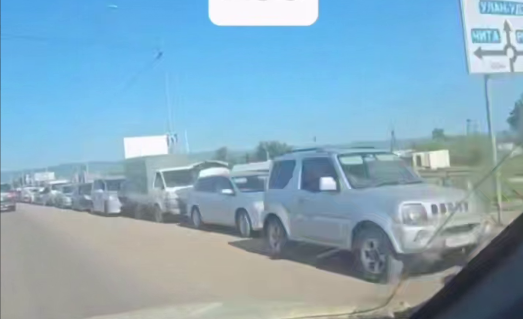 Queues at a petrol station in Russia during the fuel crisis. Queues at a petrol station in Russia during the fuel crisis.