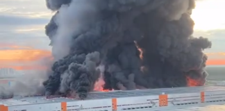 Thick black smoke hangs over the Wildberries warehouse complex in St Petersburg following a fire