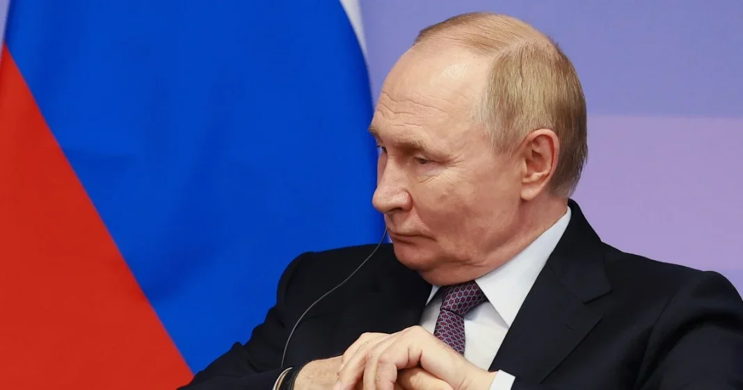 Vladimir Putin during a meeting Vladimir Putin at the table during a meeting
