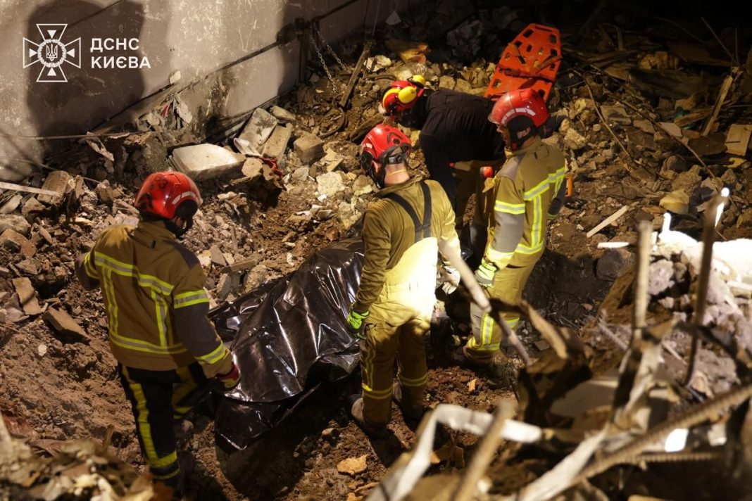 Rescue workers are at the scene of the attack in Kyiv, searching for victims.