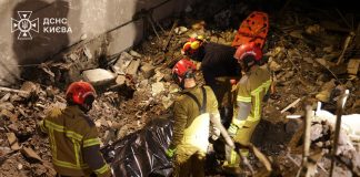 Rescue workers are at the scene of the attack in Kyiv, searching for victims.