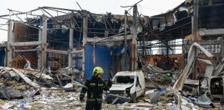 A woman was killed as a result of overnight shelling in Kyiv Rescue workers are clearing up the aftermath of the Russian shelling in Kyiv.