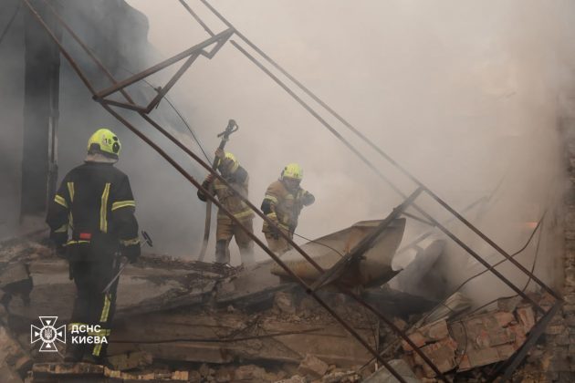 Firefighters are putting out a fire following a Russian attack on Kyiv.