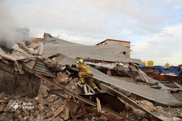 A State Emergency Service rescuer is working at the scene of the destruction following the Russian attack on Kyiv.