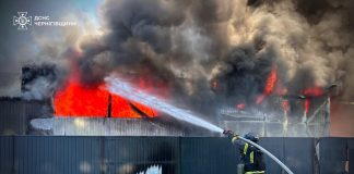 A firefighter puts out a fire following a Russian drone attack in the Chernihiv region