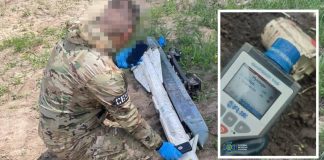 An SBU specialist is testing fragments of Russian ammunition for radiation levels