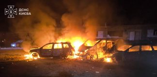 Cars are on fire in Kyiv following an overnight attack by Russia