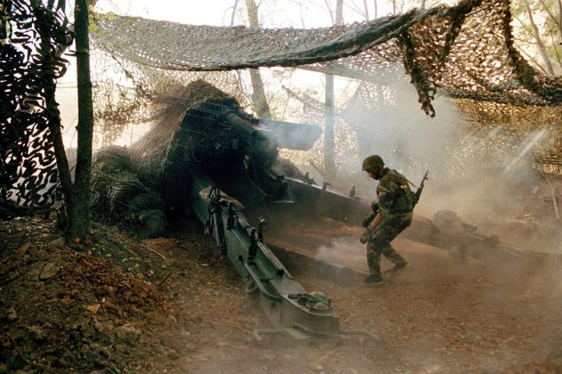 Ukrainian soldiers are working near an artillery piece