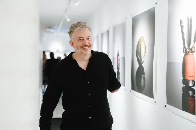 Photographer Giles Duley at the exhibition *The Things They Carried*