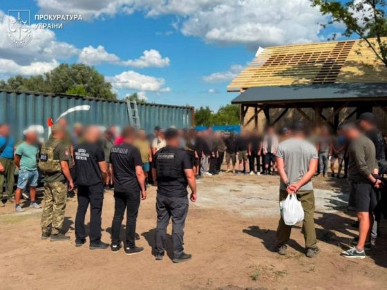 Law enforcement officers and military personnel at a private construction site in the Odesa region